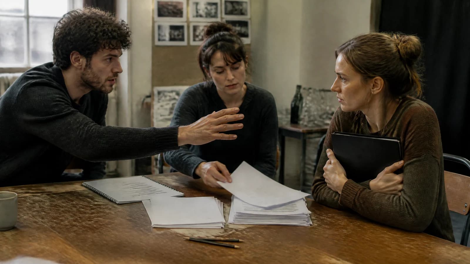 Screenwriter and actors testing the hidden objectives inside a tense rehearsal-room conversation